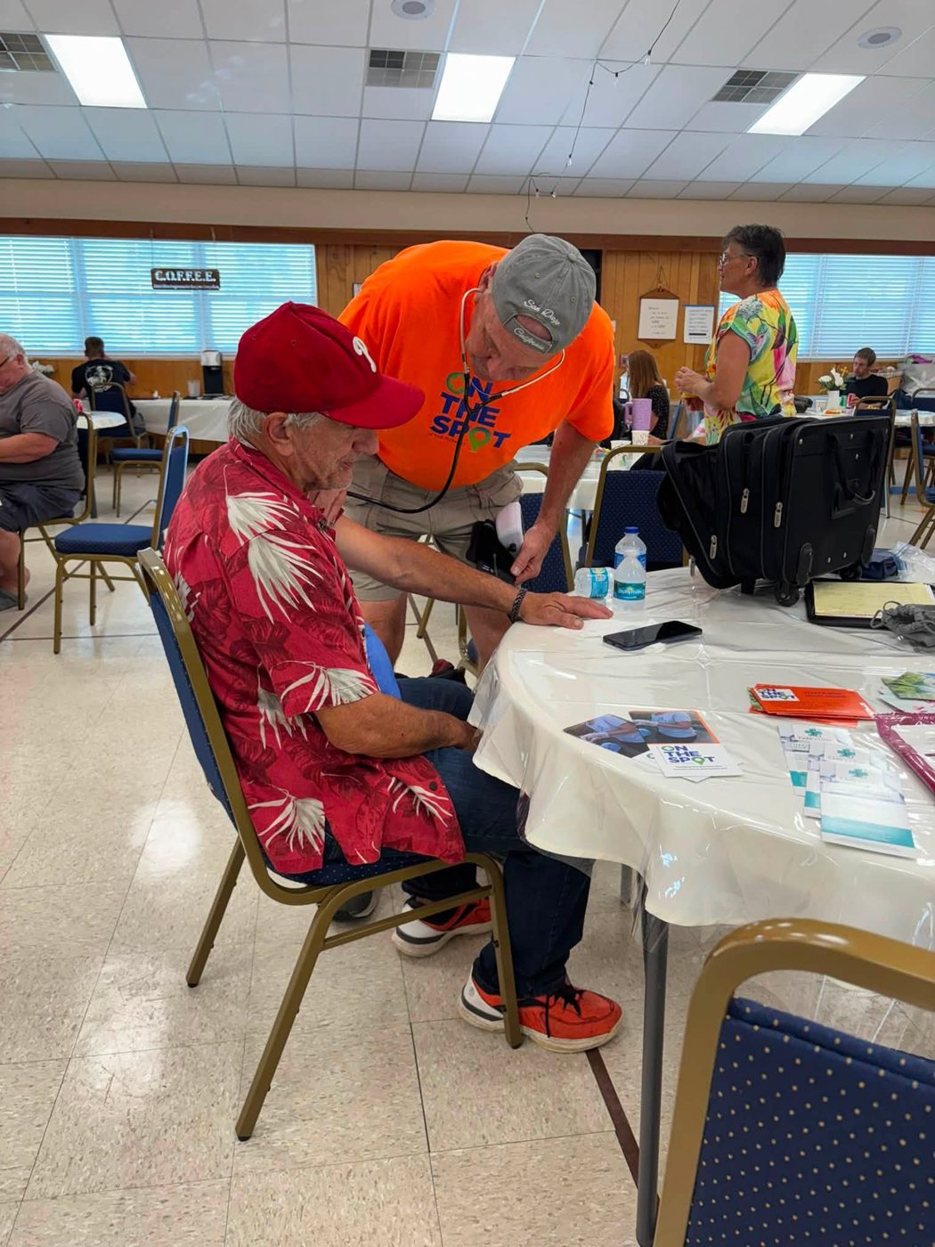 Volunteer checking blood pressure