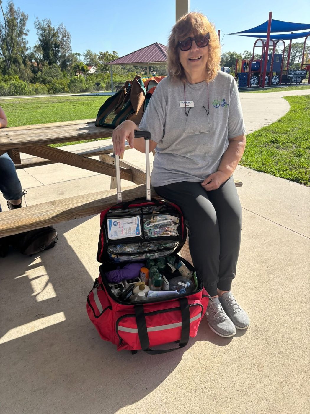 Volunteer with a first aid kit